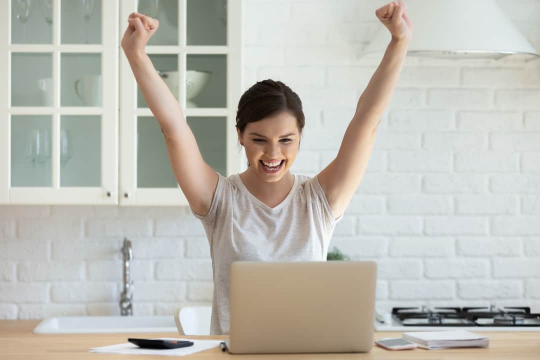 Female student is excited by email about perfect exam results